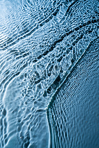 蓝色水面波纹背景摄影照片_水面波纹