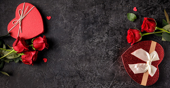 圣瓦伦丁节或生日的庆祝活动概念，有炉灶形礼品盒和红玫瑰花束