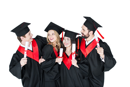 Happy students with diplomas 