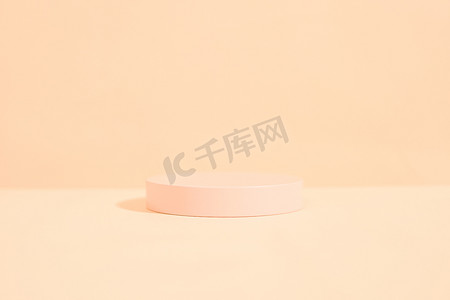 product platform arrangement in pink pastel color in minimalist style. trendy display layout with an empty podium for showcasing cosmetics, skincare, or other products.