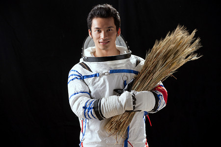 中国航天背景摄影照片_宇航员抱着麦子