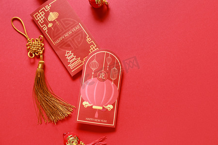 year摄影照片_Red envelopes on color background. New Year celebration