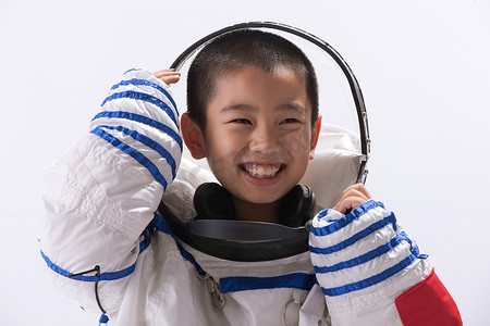 儿童宇航服摄影照片_一个身穿宇航服的东方儿童