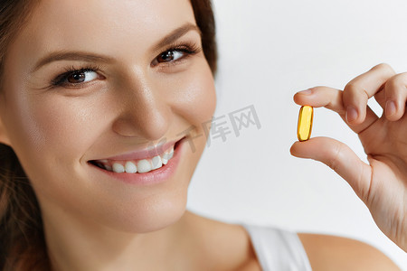 Vitamins. Healthy Eating. Happy  Girl With Omega-3 Fish Oil Caps