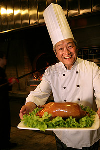 庐州烤鸭摄影照片_中国厨师和烤鸭