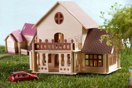 玩具背景素材摄影照片_静物房子模型汽车