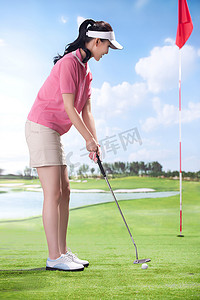 入摄影照片_东方女人打高尔夫