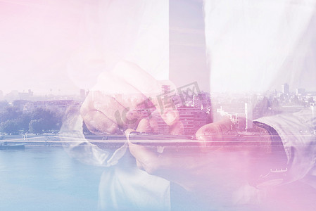 Double exposure of businessman hands with mobile smart phone