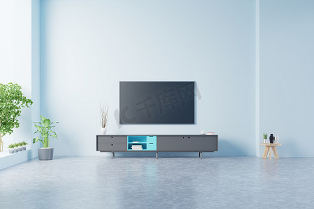 玉雕电视墙摄影照片_蓝墙背景的现代客厅橱柜里的电视，3D渲染