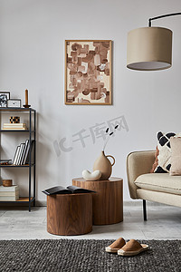 up摄影照片_Minimalist interior of elegant living room with mock up poster frame, beige modern sofa, wooden side tables and personal accessories. Creative home staging. Copy space. Template. 
