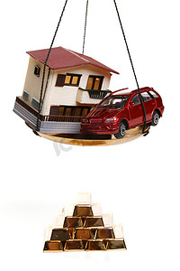 平衡车图片摄影照片_静物房子汽车模型金条