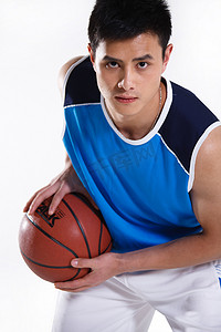 打篮球背景摄影照片_东方青年男子打篮球