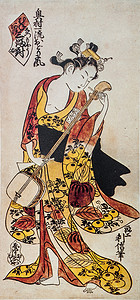 浮世绘logo摄影照片_玩日本的三弦琴。传统的日本雕刻浮世绘.