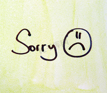 sorry note with pen