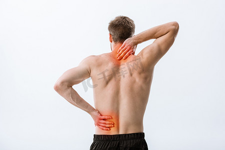 颈部疼痛摄影照片_无衬衫运动员的后视图与颈部疼痛和背痛隔离在灰色