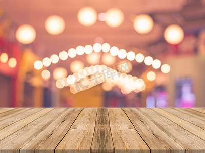 Wooden board empty table in front of blurred background. Perspective brown wood over blur in coffee shop - can be used for display or montage your products.Mock up for display product. vintage filtered image.