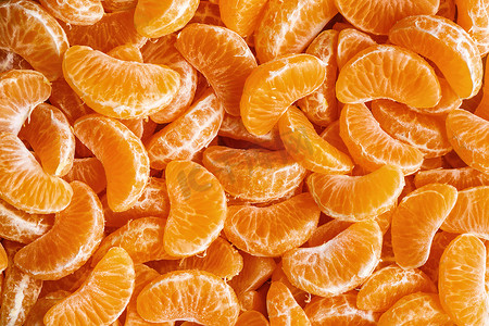 Tangerine segments, orange background texture,Flat lay, top view