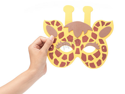 hand holding giraffe animal carnival mask isolated on white back
