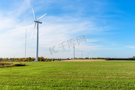 Wind farm in a rural landscape on clear autumn day. Copy space. Wolfe Island, ON, Canada.