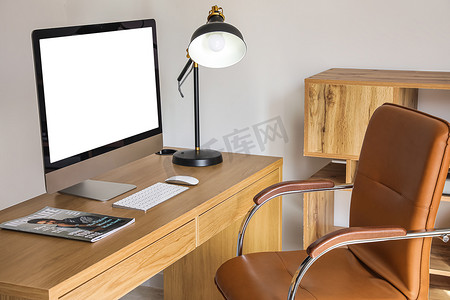 Workplace with computer, magazine and lamp in modern office