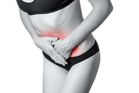 肚子痛或消化期周期与一个年轻女子的特写视图。白色背景上的孤立。带红点的黑白照片.