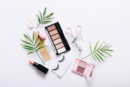 Set of professional decorative cosmetics, makeup tools and accessory on white background. Beauty, fashion and shopping concept. Flat lay composition, top view