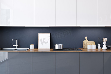 灰色厨房台面与内置的家电和一排白色橱柜挂在上面。一张镜框海报。3d 渲染模拟