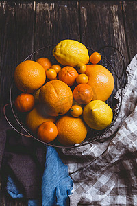 柠檬金橘摄影照片_橙子和柠檬