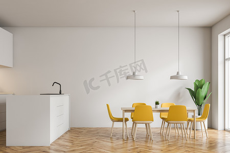 黄色椅子摄影照片_现代厨房的内部与白色的墙壁, 木地板, 白色的岛屿与内置水槽和木桌与黄色椅子。3d 渲染