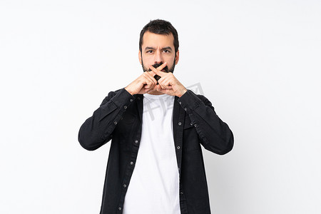 Young man with beard over isolated white background showing a sign of silence gesture