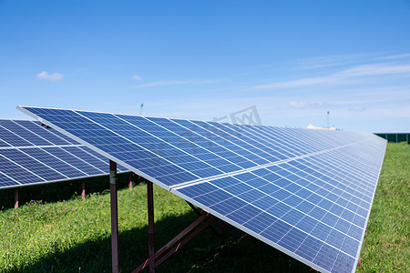 Solar batteries power station located in a field. Renewable energy clean and good environment.