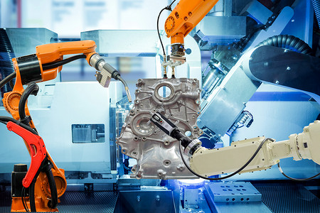 工业4.0摄影照片_智能厂汽车零部件工业机器人焊接、机器人夹持和机器人3D扫描、机器蓝调背景、工业4.0及工艺概念