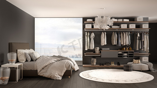 豪华白色和灰色现代卧室，配有双人床和步入式衣柜、镶木地板、带冬季全景的全景窗户、地毯、pouf、简约的建筑室内设计