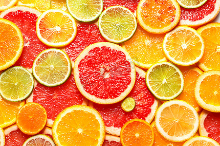 新鲜水果片摄影照片_以新鲜柑橘类水果片为背景, 最受关注