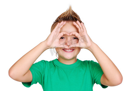 Boy in green tshirt making heart symbol with hands