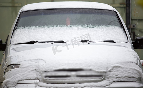 car under the snow white winter covered with cold