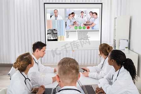hospital摄影照片_Doctors Videoconferencing With Male Doctor
