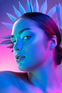 model摄影照片_Grace. High fashion model in colorful bright neon lights posing at studio. Portrait of beautiful girl with glowing make-up. Art design vivid style. Spa, cosmetics, beauty procedures