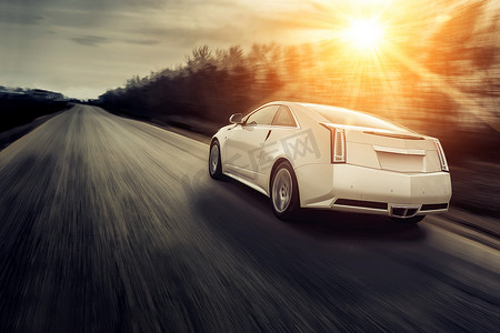 Car drive speed fast on the road at sunset cadillac