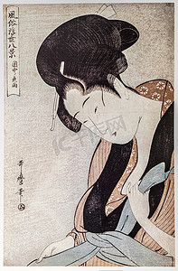 浮世绘摄影照片_在关于雨夜的卧室里的女人。北川木版。传统的日本雕刻浮世绘.