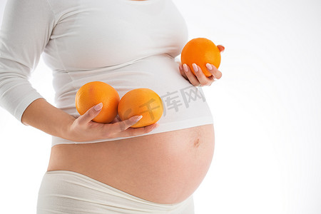 怀孕和健康饮食的概念。孕妇控股 fres