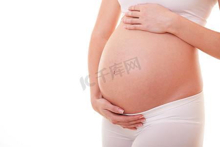 大肚子图片摄影照片_孕妇摸她的大肚子的图片。靠近点母亲、怀孕、人和期望的概念。怀孕妇女怀孕分娩