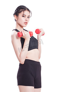 sport摄影照片_Sport woman exercising with dumbbells