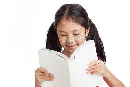 Happy little asian girl  read a book