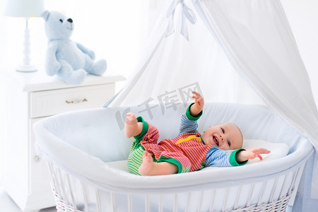 Cute baby in white nursery