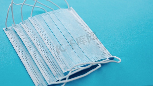 Medical mask, Medical protective masks on blue background. Disposable surgical face mask cover the mouth and nose. Healthcare and medical concept.