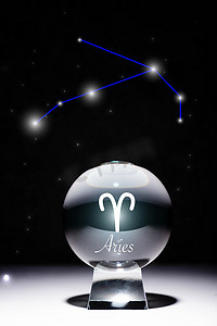 sign摄影照片_crystal ball with Aries zodiac sign isolated on black with constellation