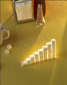 建筑冰块摄影照片_黄色桌子上图表形状的糖块堆