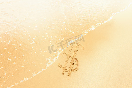 符号指示标摄影照片_被海浪冲走的沙子上的美元符号