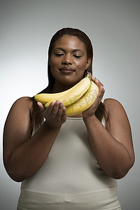礼仪之邦摄影照片_拿着香蕉的女人